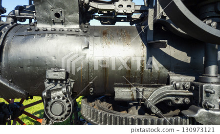 Nitra, Slovakia - September 4, 2025: A vintage locomotive on the grounds of the Agricultural University of Nitra. Close-up. Mechanism. Nitra, Slovakia - September 4, 2025: A vintage locomotive on the grounds of the Agricultural University of Nitra. Close-up. Mechanism. 130973121