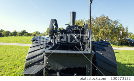 Nitra, Slovakia - September 4, 2025: A vintage traction engine on display at the Agricultural University of Nitra. Rear view. 130973122