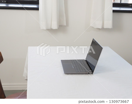 Laptop on a white table 130973667