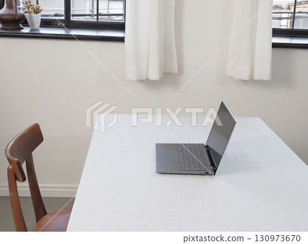 Laptop on a white table 130973670