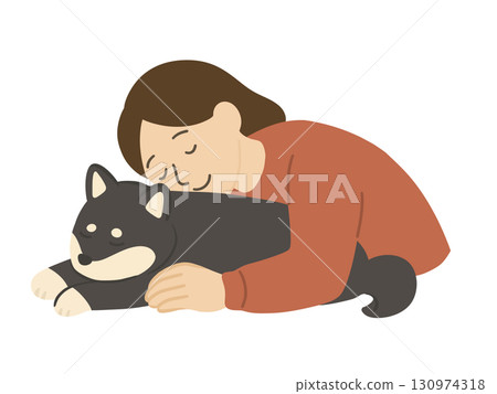 一名女子抱著一隻黑色的柴犬 一名女子抱著一隻黑色的柴犬 130974318