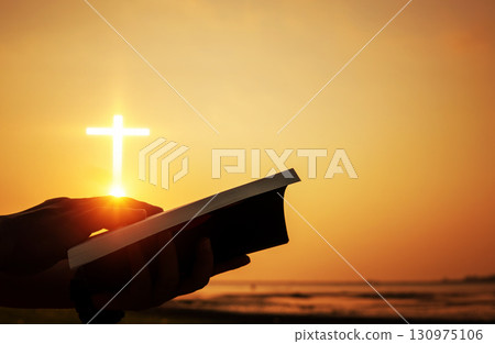Christian praise on hill thanksgiving day background. Christian man or woman hands holding and reading a bible holy. Hands folded in prayer. worship god with christian concept religion. 130975106