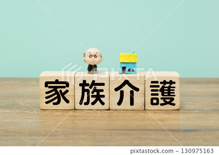 Wooden blocks and elderly dolls representing family care Wooden blocks and elderly dolls representing family care 130975163
