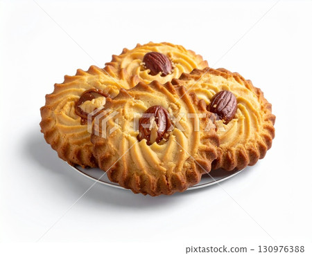 Butter Cookies with Pecans on White Plate Butter Cookies with Pecans on White Plate 130976388