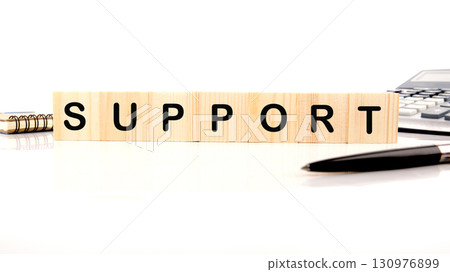 The concept word SUPPORT has been collected of wooden cubes on a white background. Business and SUPPORT concept. Copy space The concept word SUPPORT has been collected of wooden cubes on a white background. Business and SUPPORT concept. Copy space 130976899