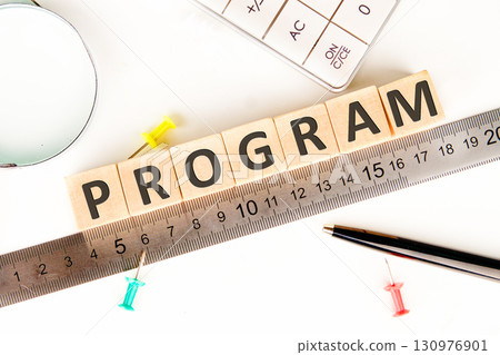 The concept word PROGRAM is assembled from wooden cubes on a white surface. Loyalty Program Shopping concept 130976901