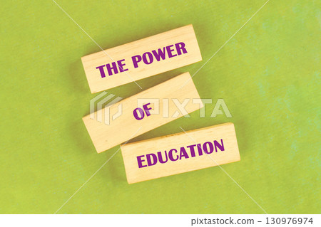 Business and Words Matter concept. Copy space. THE POWER OF EDUCATION assembled from blocks on a light green background, top view Business and Words Matter concept. Copy space. THE POWER OF EDUCATION assembled from blocks on a light green background, top view 130976974