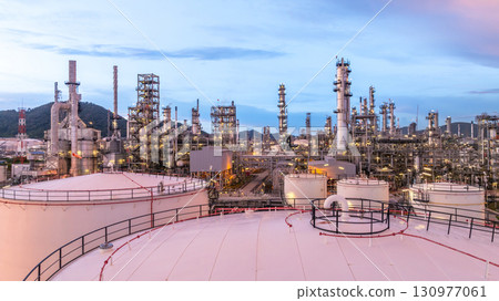 Aerial view oil and gas refinery plant at night, Global business energy logistic transportation, Oil and gas refinery petrochemical industrial, Petrochemical refinery industrial energy supply chain. 130977061
