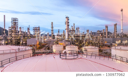 Aerial view oil and gas refinery plant at night, Global business energy logistic transportation, Oil and gas refinery petrochemical industrial, Petrochemical refinery industrial energy supply chain. 130977062