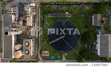 Aerial view wastewater treatment plant, Sustainable water management environment, Black water treatment tank with waste water, Circle circular water clarifier cleaning water. Aerial view wastewater treatment plant, Sustainable water management environment, Black water treatment tank with waste water, Circle circular water clarifier cleaning water. 130977067