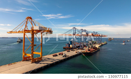 Aerial view container cargo ship international port terminal with gantry crane, Global business import export logistic maritime transport by container cargo ship vessel, Container ship cargo freight. 130977115