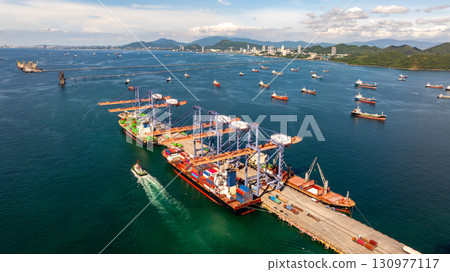 Aerial view container cargo ship international port terminal with gantry crane, Global business import export logistic maritime transport by container cargo ship vessel, Container ship cargo freight. 130977117