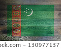 Turkmenistan flag on rustic old wood surface background 130977137