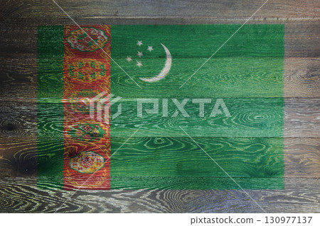 Turkmenistan flag on rustic old wood surface background Turkmenistan flag on rustic old wood surface background 130977137