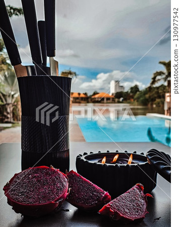 Tropical still life with dragon fruit by the pool. 130977542