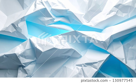 A close-up of a blue crumpled paper ball shows the intricate texture of a wrinkled and crushed wastepaper sheet 130977545