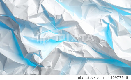 A close-up of a blue crumpled paper ball shows the intricate texture of a wrinkled and crushed wastepaper sheet A close-up of a blue crumpled paper ball shows the intricate texture of a wrinkled and crushed wastepaper sheet 130977546