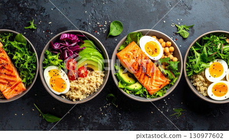 A colorful, healthy vegetarian dish of fresh vegetables on a wooden plate A colorful, healthy vegetarian dish of fresh vegetables on a wooden plate 130977602