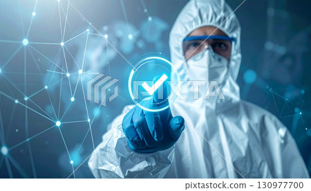A caring female medical doctor wearing a mask and holding a syringe symbolizes the front lines of modern healthcare and medical research 130977700