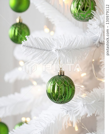 [AI image] A white Christmas tree decorated with green ornaments 130979112