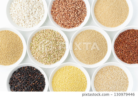 Various types of grains arranged on a plate 130979446