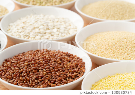 Various types of grains arranged on a plate 130980784