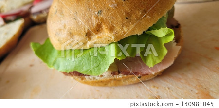 Savor a Delicious Sandwich made with Fresh Ingredients that will delight your taste buds 130981045