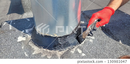 Roof Maintenance Sealing the Pipe Base to Enhance Durability and Longevity of Your Roof 130981047