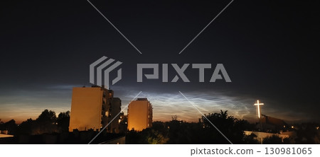 Dusk Serenity An Urban Landscape Featuring Noctilucent Clouds and a Cross Structure Dusk Serenity An Urban Landscape Featuring Noctilucent Clouds and a Cross Structure 130981065