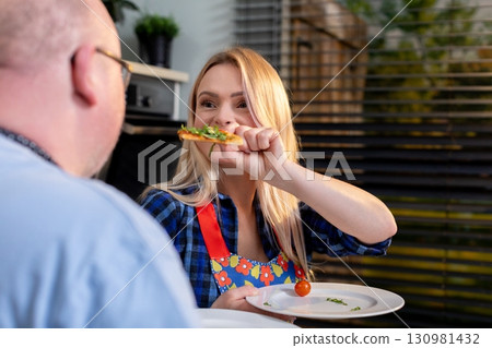 Enjoying a Delicious Meal Together in a Cozy Setting that Enhances Our Experience Enjoying a Delicious Meal Together in a Cozy Setting that Enhances Our Experience 130981432