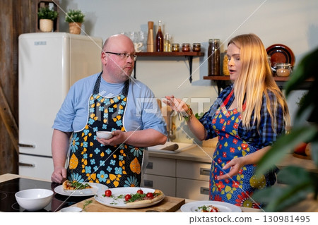 Culinary Interaction Takes Center Stage in the Heart of a Modern Kitchen Environment Setting 130981495