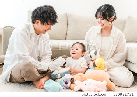 A family of child-rearing generation playing with their child and baby in the living room of their home (childcare, parenting, skinship) A family of child-rearing generation playing with their child and baby in the living room of their home (childcare, parenting, skinship) 130981731