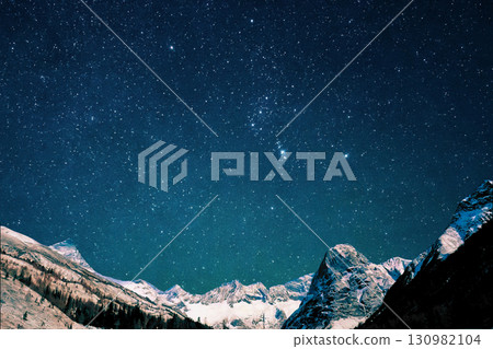 star trails in the mountains snow falling in the mountains 130982104