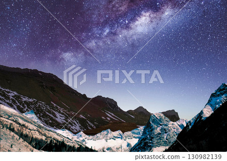 star trails in the mountains snow falling in the mountains star trails in the mountains snow falling in the mountains 130982139