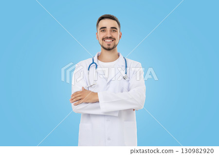 Doctor wearing lab coat and stethoscope with arms crossed Doctor wearing lab coat and stethoscope with arms crossed 130982920