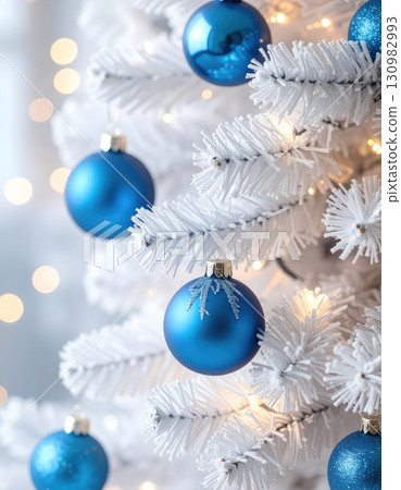 [AI image] A white Christmas tree decorated with blue ornaments 130982993