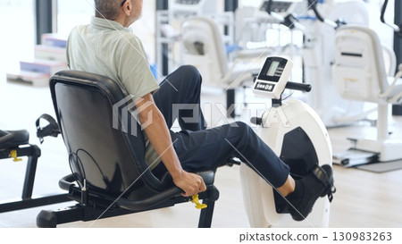 Asian elderly people exercising on recumbent bikes Asian elderly people exercising on recumbent bikes 130983263
