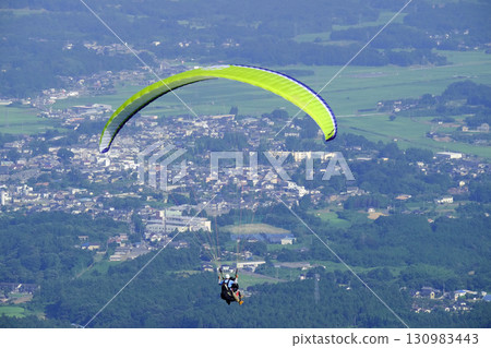 Early summer sky and paraglider 130983443