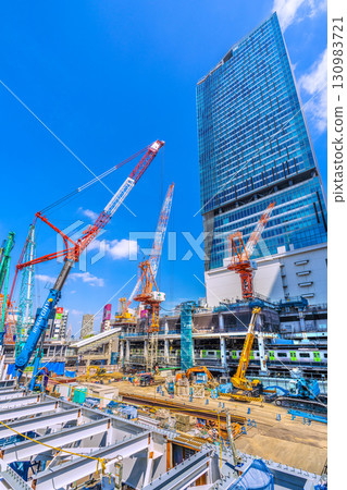 Tokyo cityscape, Japan, September 17th. Huge heavy machinery such as crawler cranes and pile drivers are lined up... = Shibuya 130983721