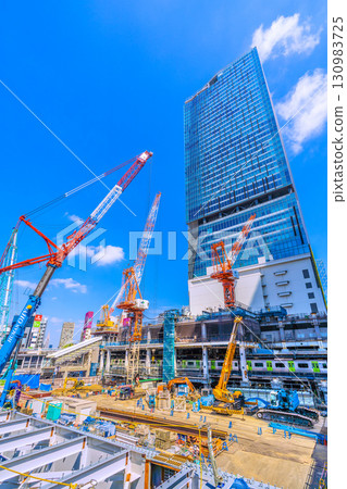 Tokyo cityscape, Japan, September 17th. Huge heavy machinery such as crawler cranes lined up... = Shibuya 130983725
