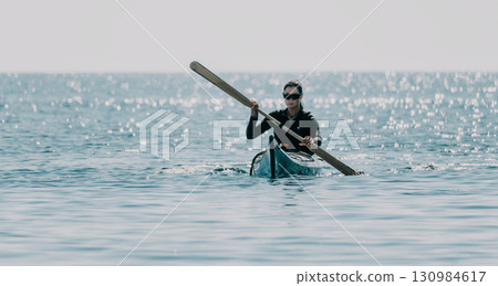 Kayaking, Ocean, Paddle - Woman Paddling Kayak in Rough Sea Conditions 130984617
