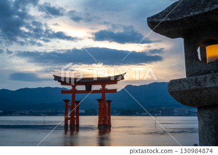 Torii of Itsukushima Shrine at sunset on Miyajima island 130984874