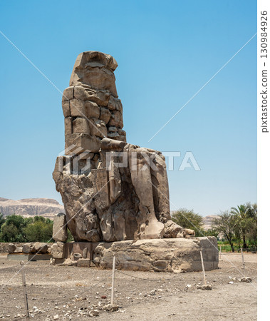 The Colossi of Memnon Standing Against a Mountainous Backdrop The Colossi of Memnon Standing Against a Mountainous Backdrop 130984926