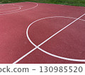 A multipurpose playground with rubber coating and markings for tennis, basketball and volleyball. 130985520