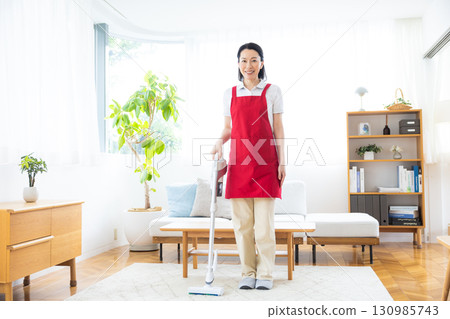 Cleaning, housekeeping, middle-aged woman cleaning 130985743
