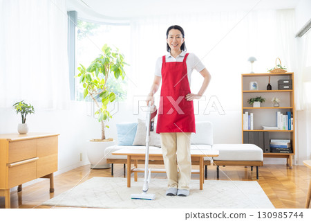 Cleaning, housekeeping, middle-aged woman cleaning 130985744