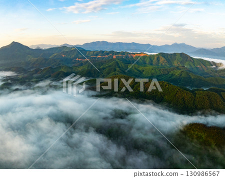 Drone aerial view of landscape mountains view in sunrise or sunset time,High angle view over countryside at northern Vietnam Drone aerial view of landscape mountains view in sunrise or sunset time,High angle view over countryside at northern Vietnam 130986567