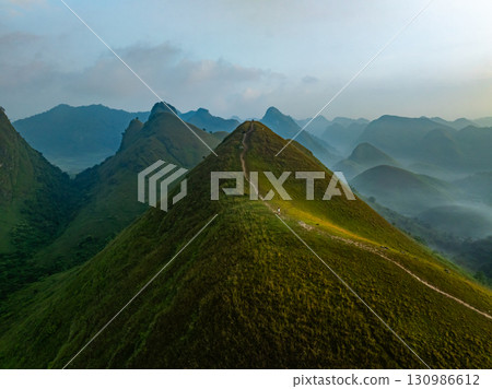 Drone aerial view of landscape mountains view in sunrise or sunset time,High angle view over countryside at northern Vietnam Drone aerial view of landscape mountains view in sunrise or sunset time,High angle view over countryside at northern Vietnam 130986612