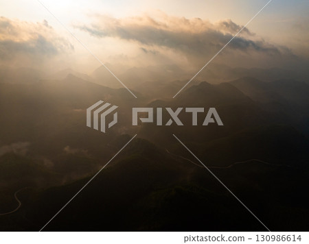 Drone aerial view of landscape mountains view in sunrise or sunset time,High angle view over countryside at northern Vietnam Drone aerial view of landscape mountains view in sunrise or sunset time,High angle view over countryside at northern Vietnam 130986614