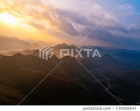 Drone aerial view of landscape mountains view in sunrise or sunset time,High angle view over countryside at northern Vietnam Drone aerial view of landscape mountains view in sunrise or sunset time,High angle view over countryside at northern Vietnam 130986641